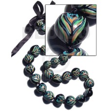 kukui seeds in animal print  peacock