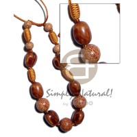 capsule wrapped wood beads with rubber seed,