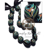 kukui seeds in animal print  peacock