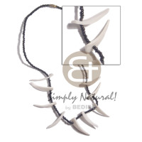 white clam tusks in black glass beads
