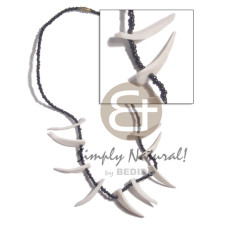 white clam tusks in black glass beads