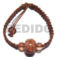 brown wax cord macrame with crushed shells in resin ball