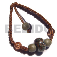 brown wax cord macrame with crushed shells in resin ball and round
