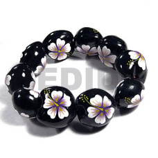 elastic black kukui nut with back to back white flower with purple