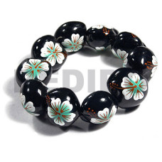 elastic black kukui nut with back to back white flower with pastel