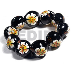 elastic black kukui nut with back to back white flower with yellow