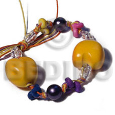 gloden yellow kukui nuts in yellowithpurple orange wax cord with gla
