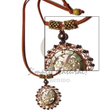 carved blacklip shell with brass wire on